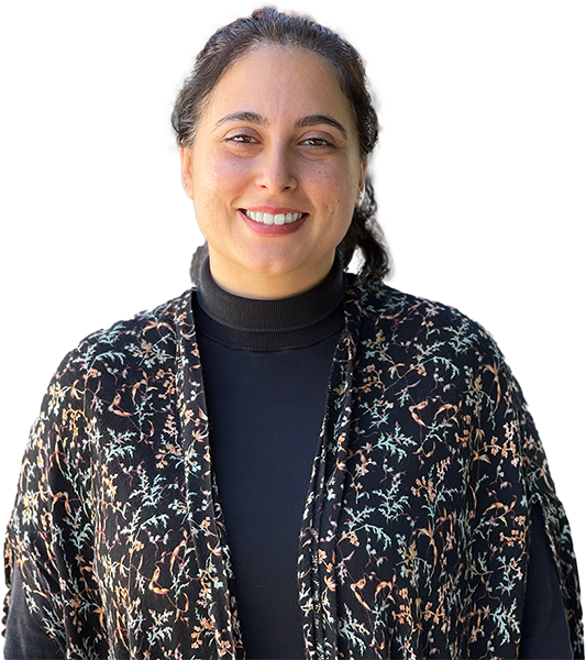 a woman wearing a black shirt and a floral cardigan.