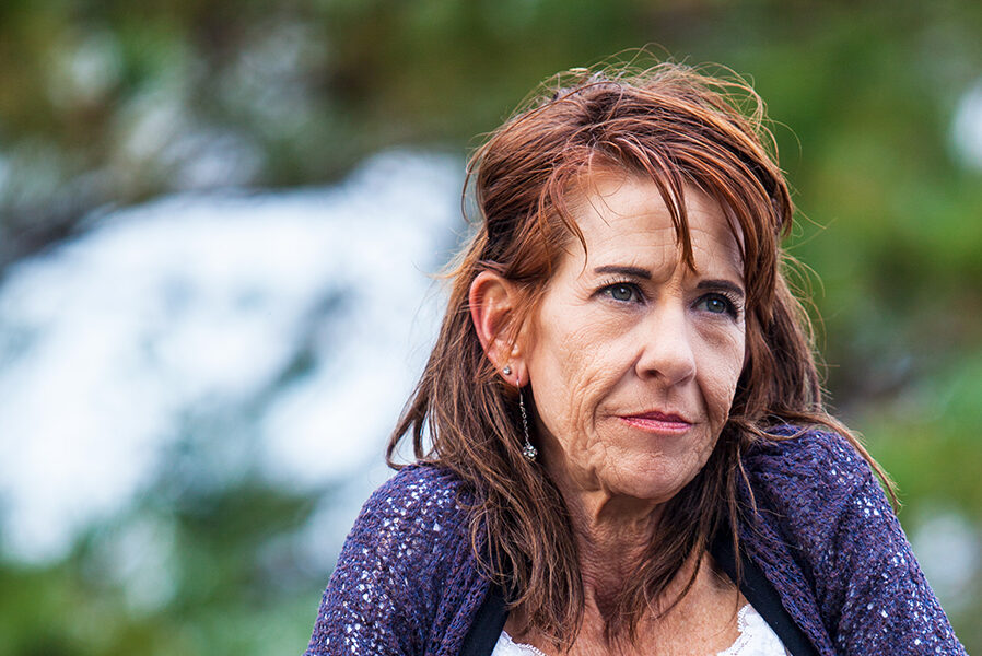 Houston client, Marcella, standing outside