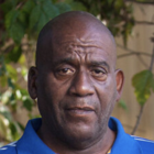 a close up of a person wearing a blue shirt.