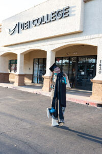 Phoenix Client, Lisa, outside of UEI College in her graduation robe