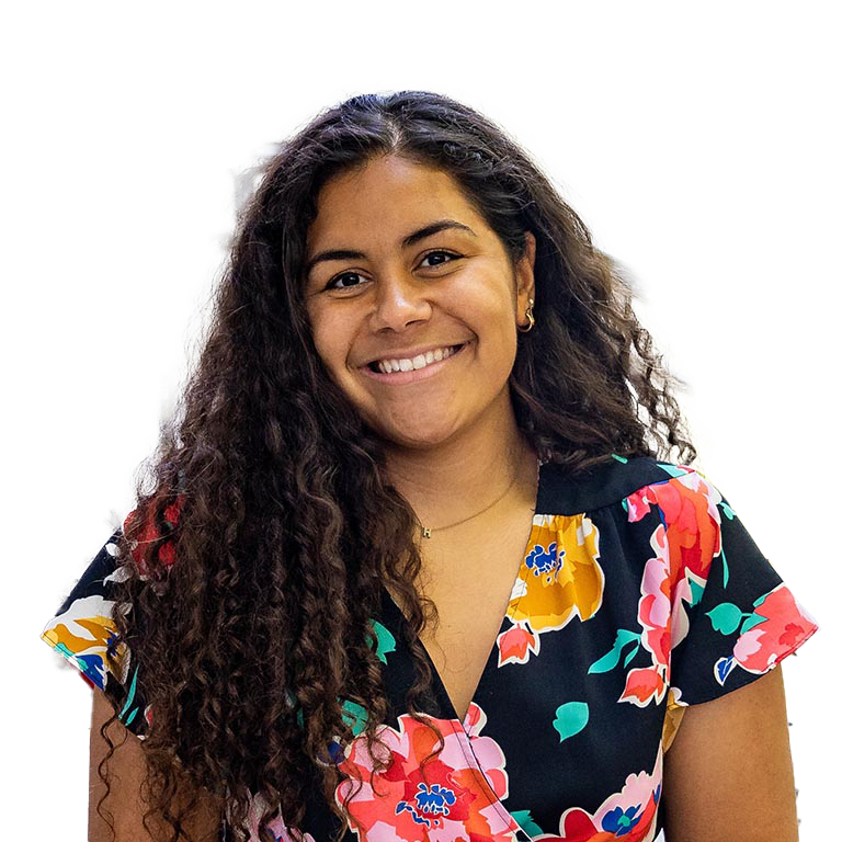 a woman with curly hair and a colorful floral top, with a transparent background