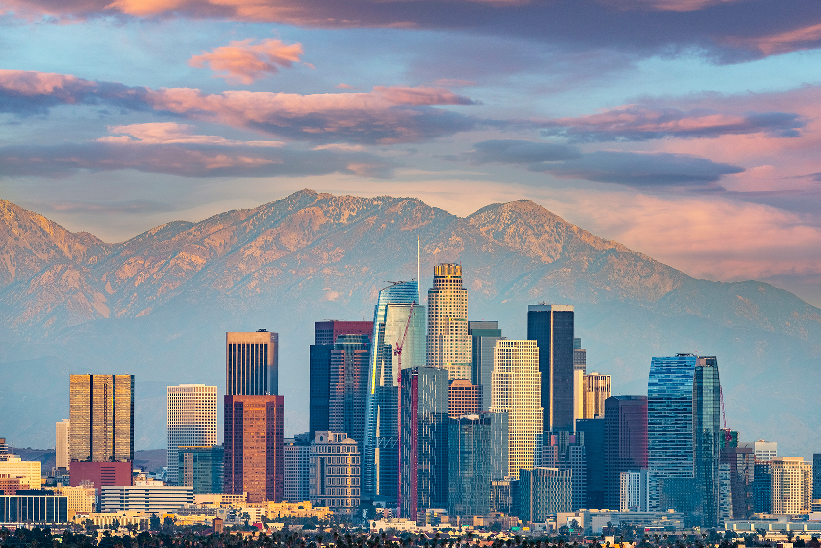 A view of Los Angeles with mountains in the background.
